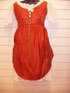 Ivory dress with Brown/Orange overlay.
This dress has flowers attached to the bodice.