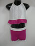 Black & White polka dot halter neck top with pink frill.
Pink lycra hot pants with matching black & white polka dot frills.