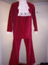 Austin Powers Costume.
This outfit comes with Maroon pants, jacket. There are frills on sleeve and around neck. This outfit also comes with glasses and wig if needed.
